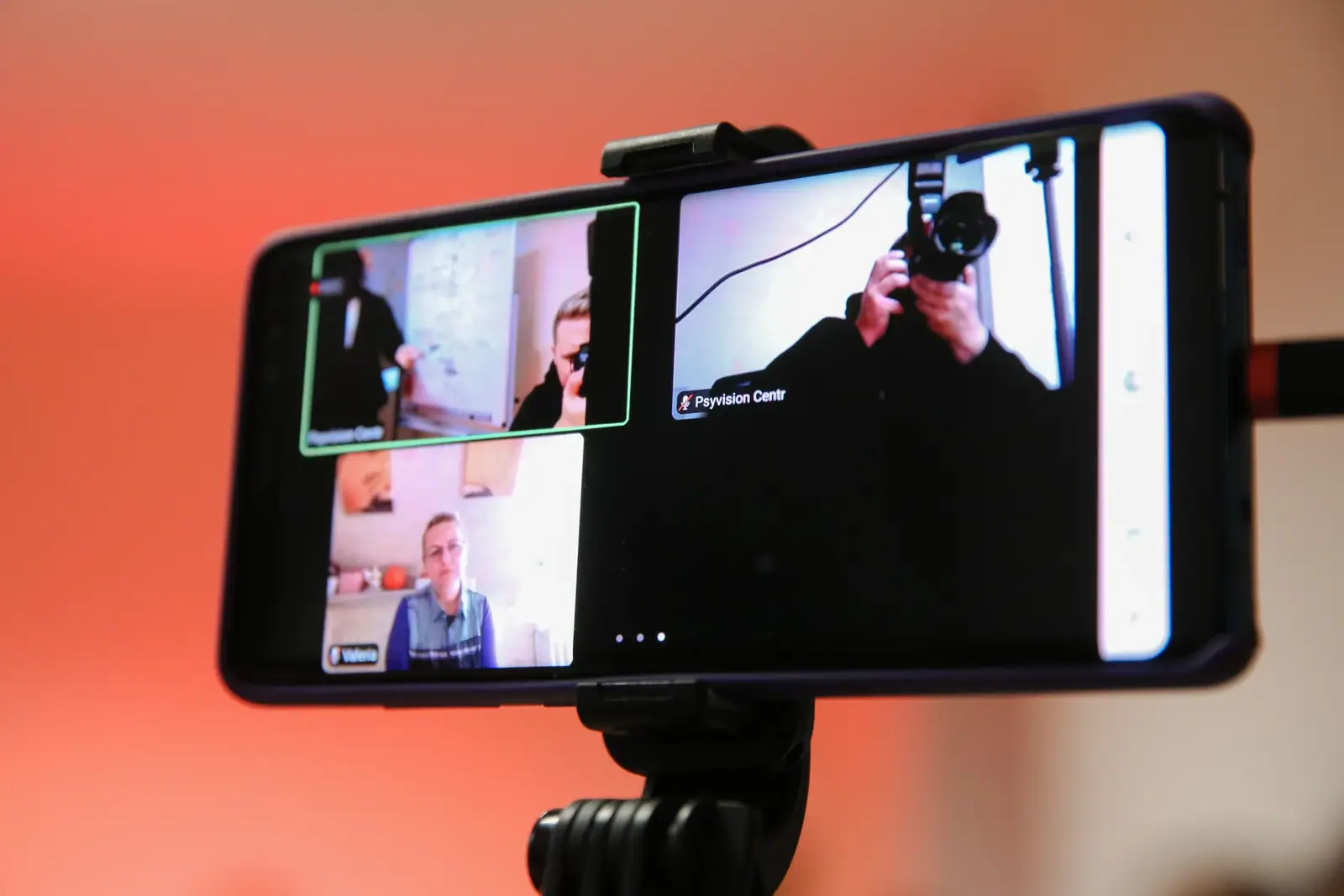 An online meeting on a phone screen: participants join from home
